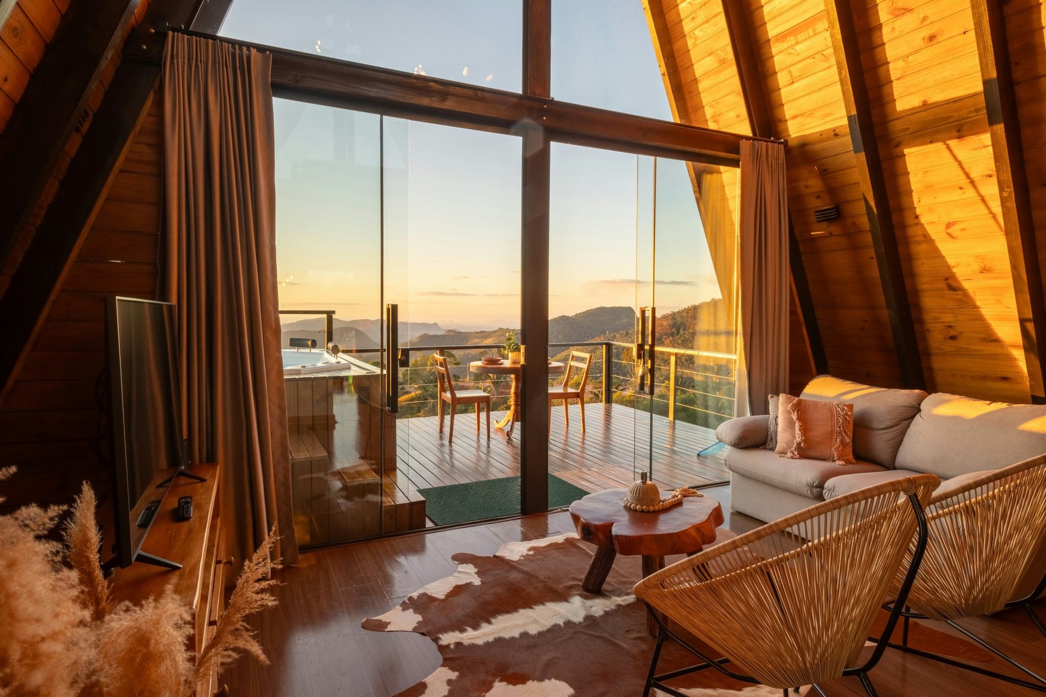 A chalet living room with a view of the mountains