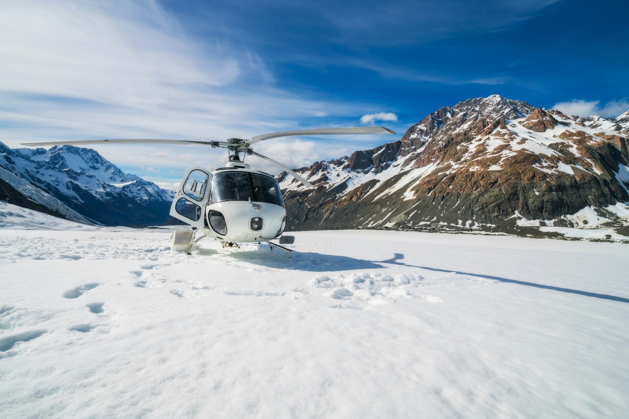 A helicopter on a snowy mountain top