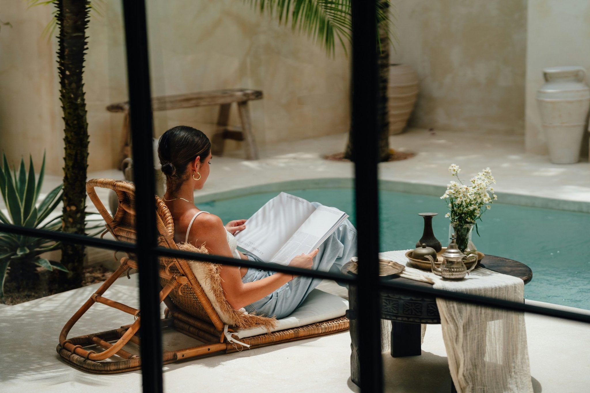 A guest relaxing by the bath in a hotel suite