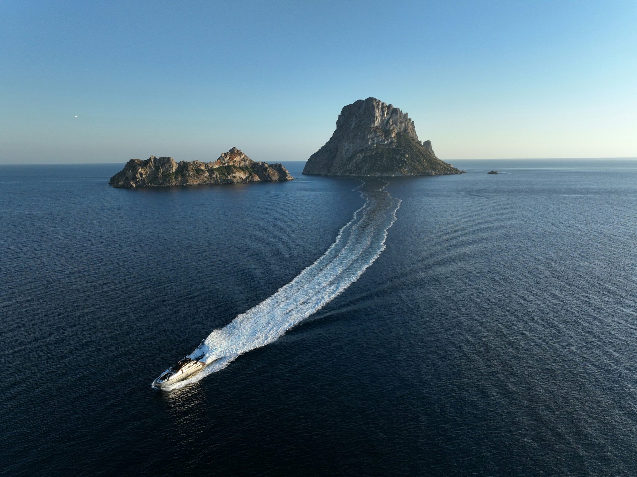 A boat heading for Es Vedrà off Ibiza